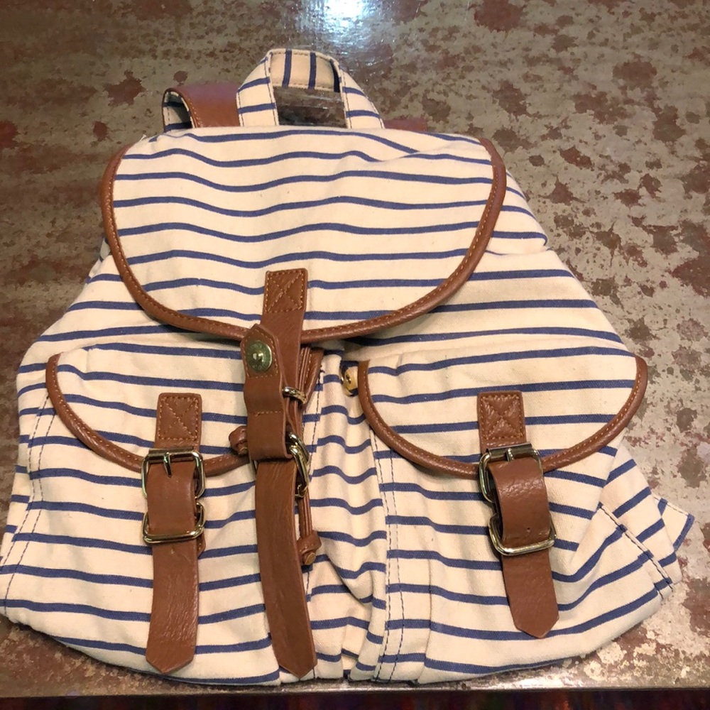 Striped backpack with leather straps